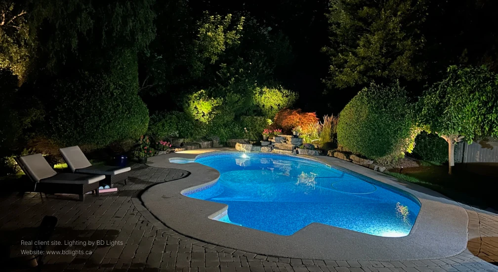 Real landscape lighting project completed by BDLights at a Mississauga home in the Greater Toronto Area, showing professionally installed low voltage LED path lights and spotlights illuminating the backyard at night