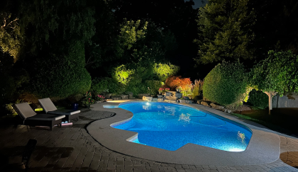 BD Lighting outdoor lighting and landscape lighting highlighting a backyard pool and garden in Oakville