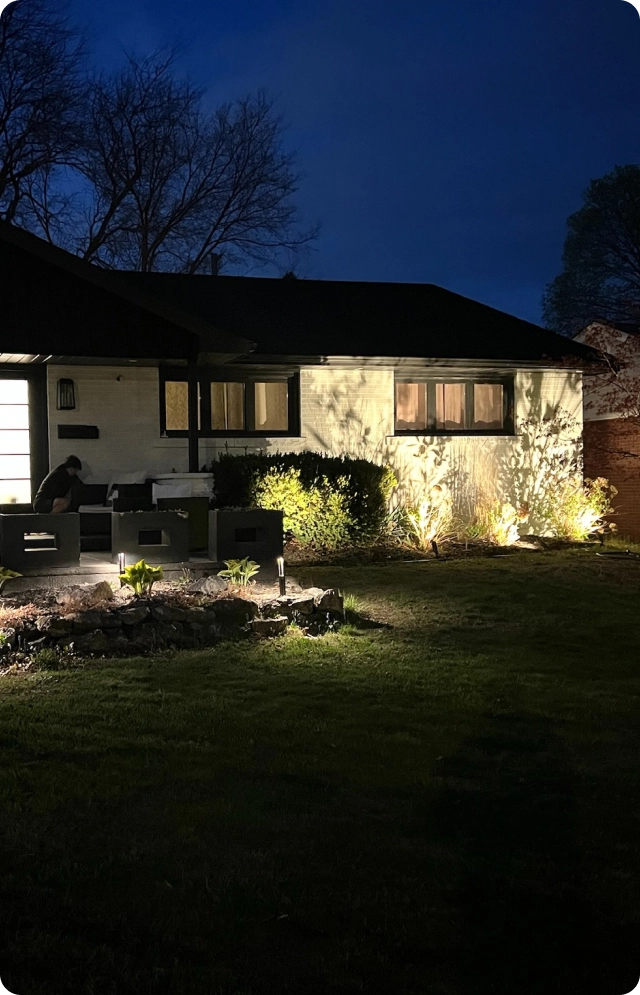 landscape outdoor lighting installed at a Burlington home at night