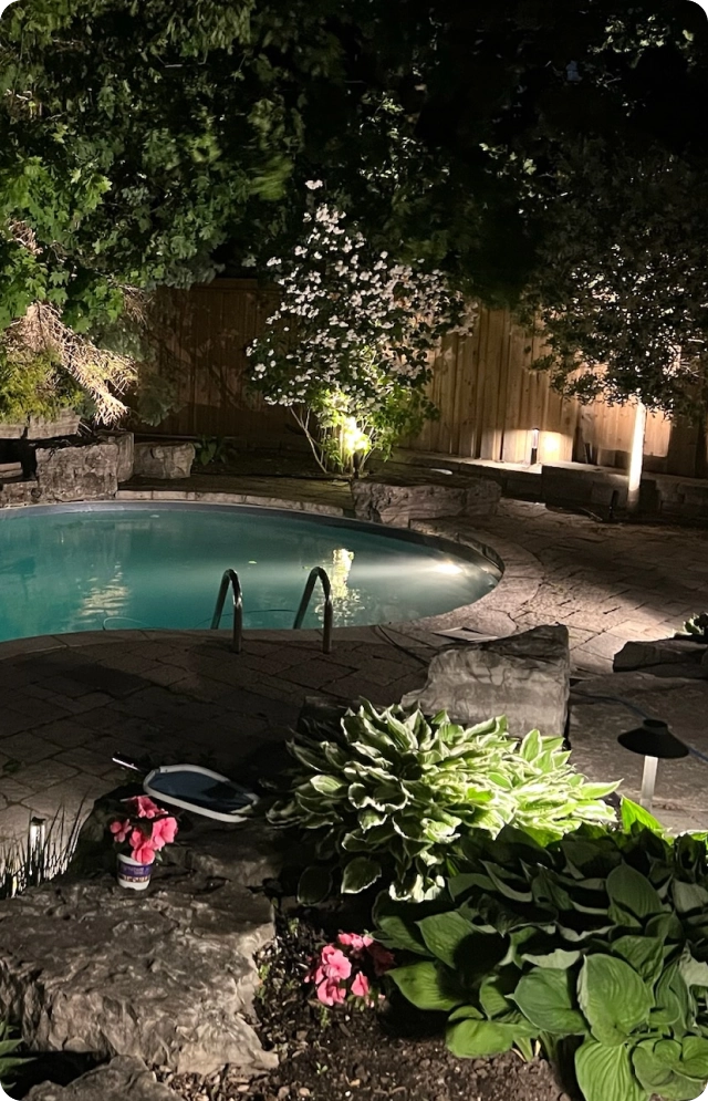 landscape outdoor lighting installed at a Oakville home at night