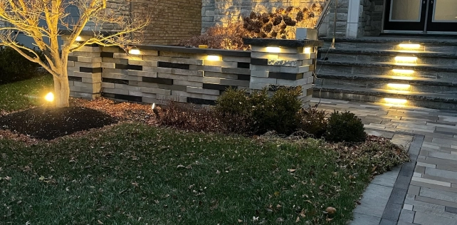 Hardscape lighting integrated into retaining wall and stone features in Toronto — landscape lighting by BD Lights