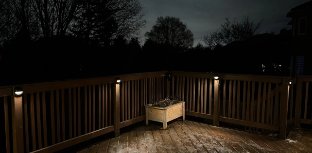 Outdoor deck lights providing ambient lighting for Toronto patios and decks — diecast brass finish
